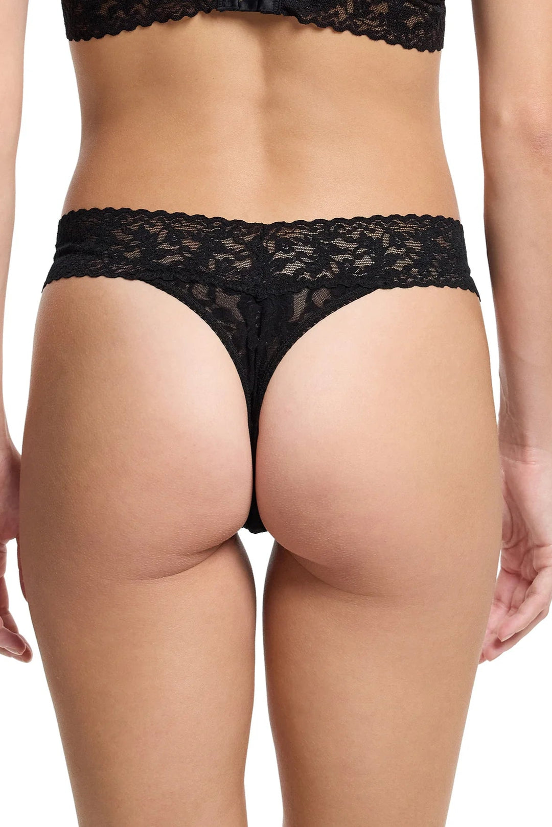 Black lace underwear on a plain background
