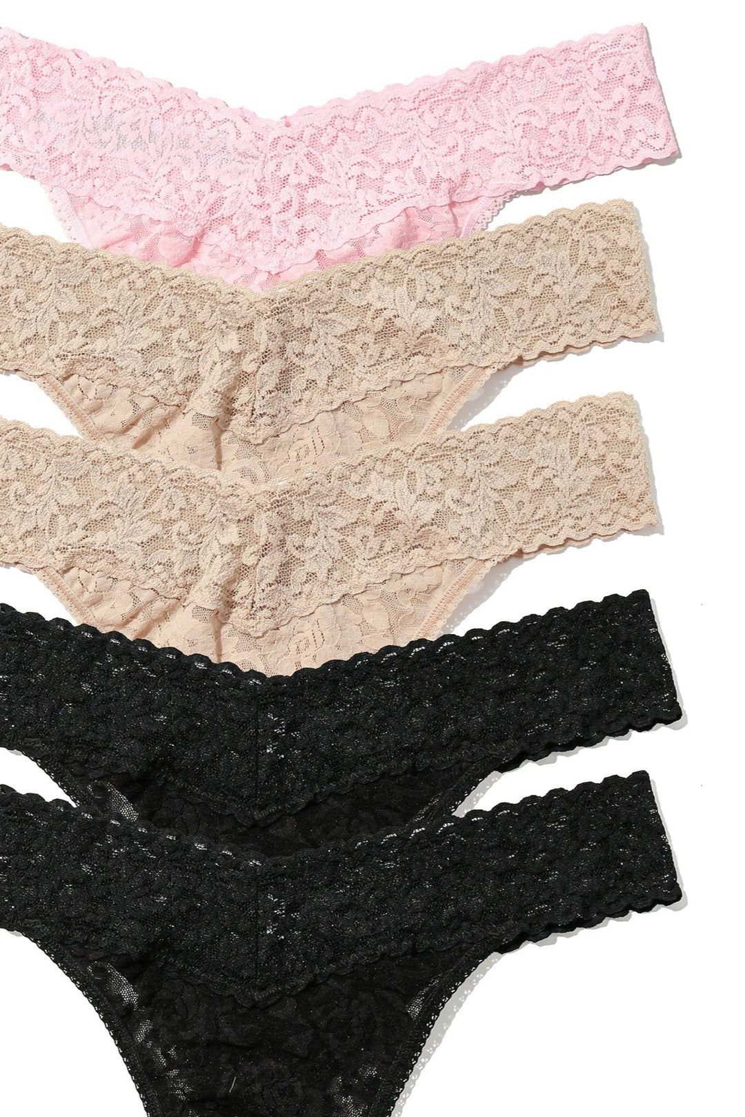 Three pairs of lace panties in pink, beige, and black on a white background.