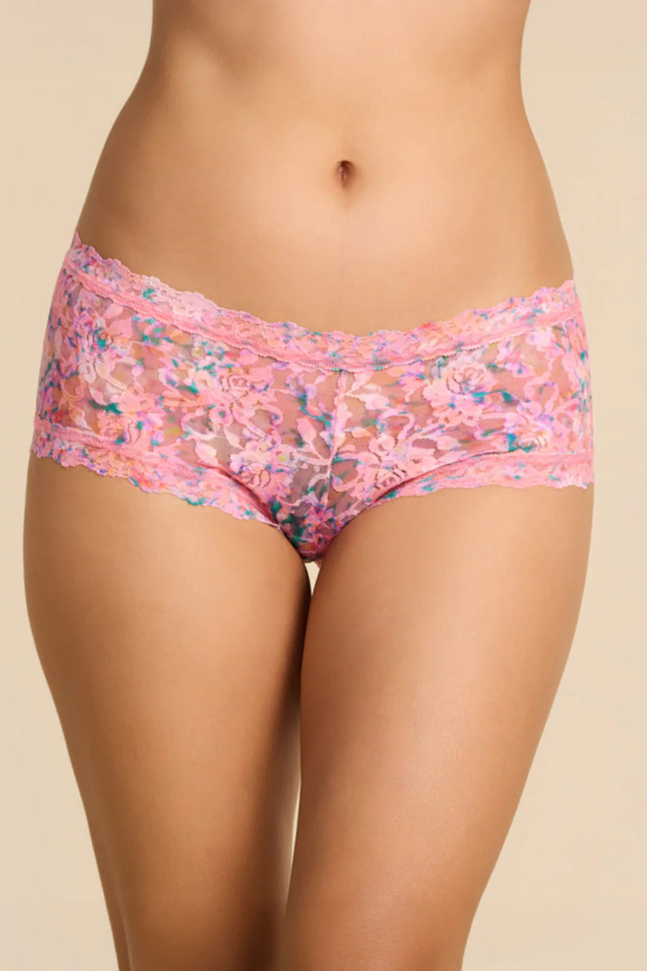 Floral-patterned underwear worn by a person on a beige background