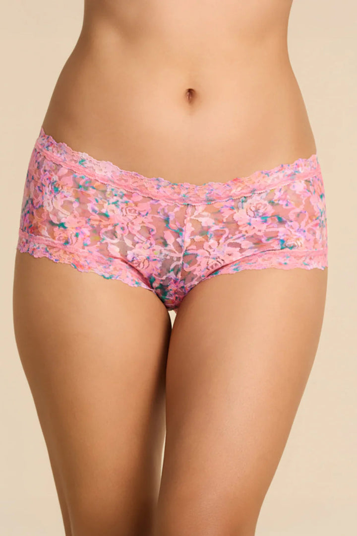 Floral-patterned underwear worn by a person on a beige background