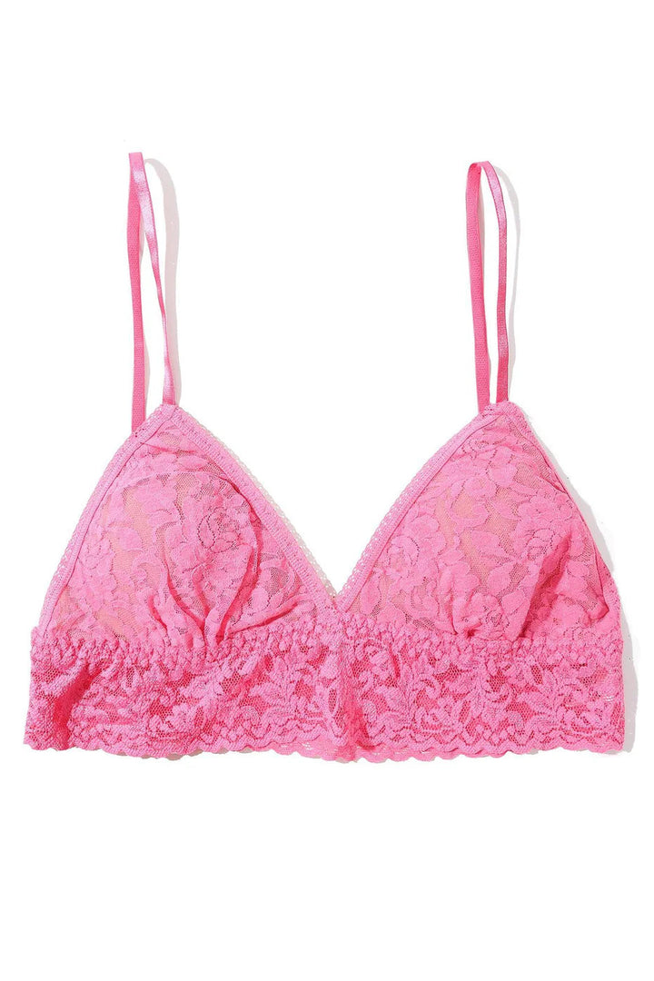 Pink lace padded bra on white background.