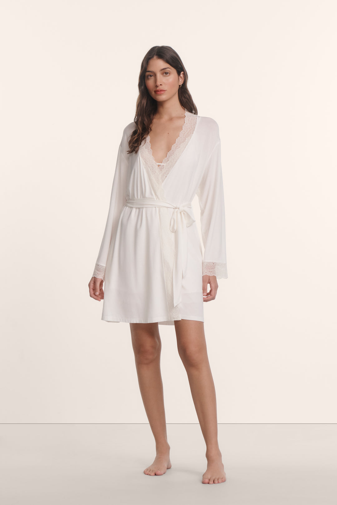 Woman wearing an eberjey lara lace robe in white. Pair with matching chemise or cami/short set.