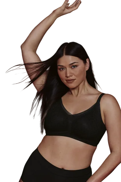 Woman in black lingerie standing on a white background