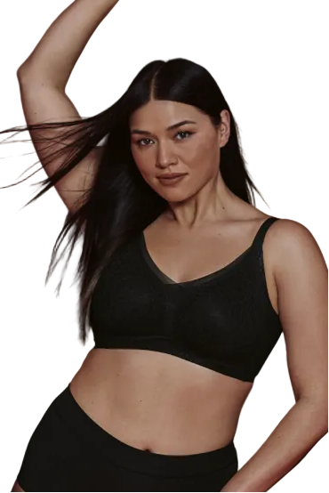 Woman in black lingerie standing on a white background