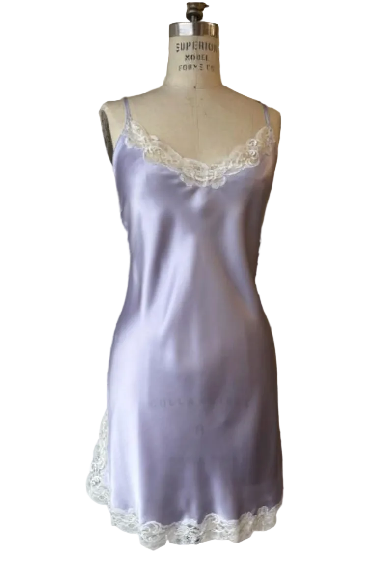 Lavender silk nightgown with lace trim on a mannequin against a neutral background