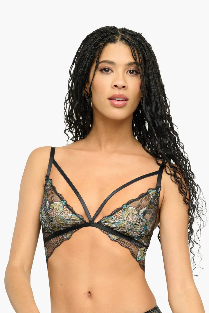 Woman wearing a floral lingerie set on a white background