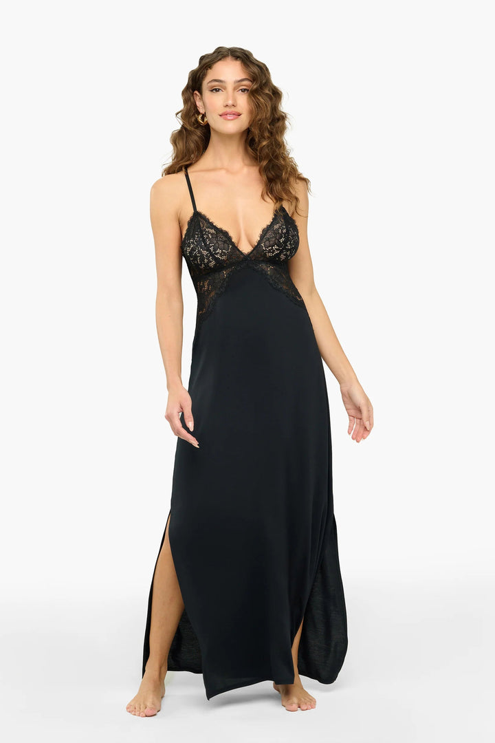 Woman wearing a black lace nightgown on a white background