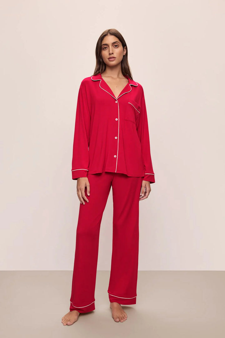 woman in red piped pajamas with buttons and long pants
