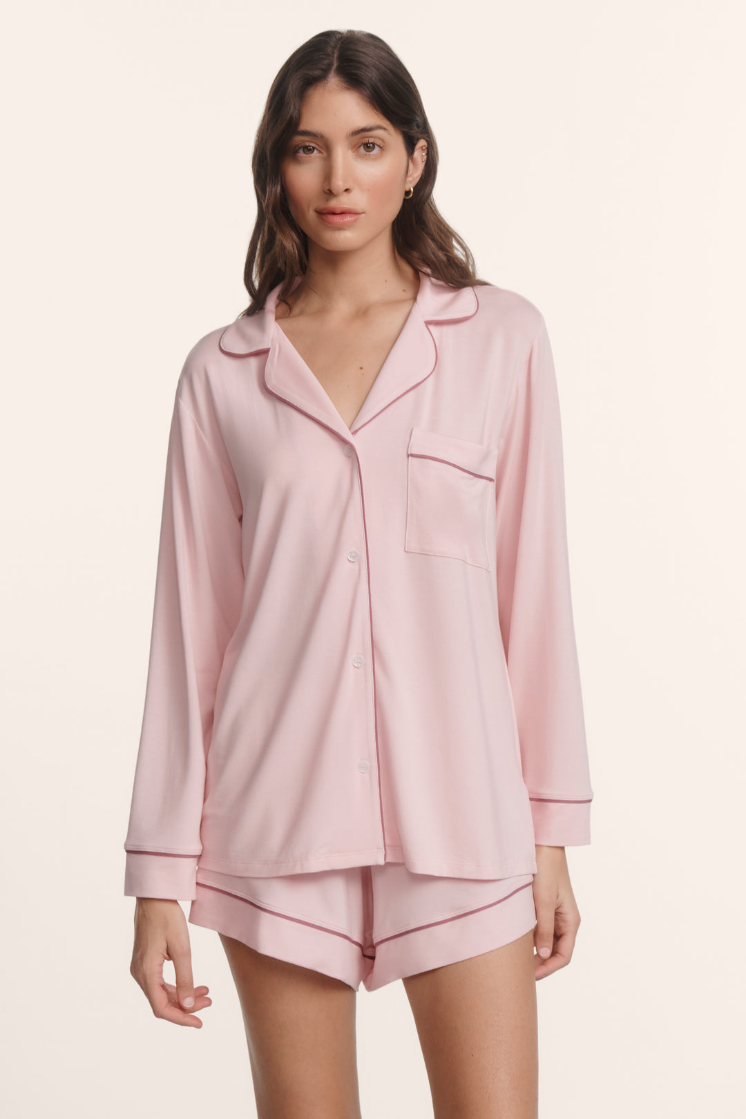 Woman wearing an eberjey gisele long sleeve short pj set in pale pink/fig