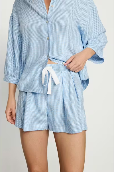 Light blue checkered lounge set on a plain background
