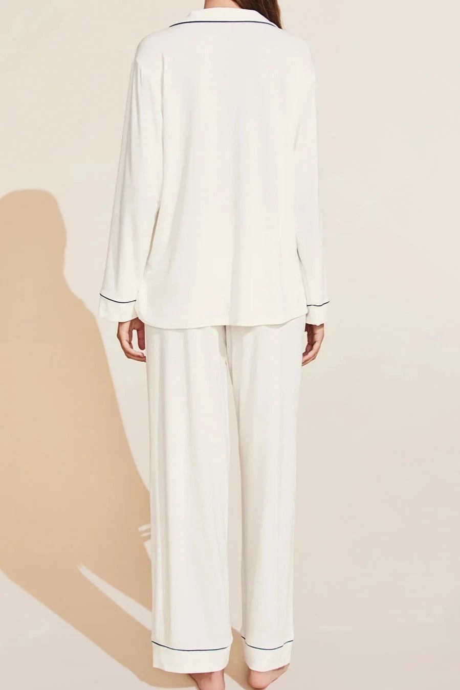 Classic long sleeve luxury pajama set with button front, collar and contrast piping in soft and comfortable ivory modal jersey.