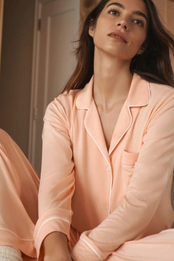 Classic long sleeve luxury pajama set with button front, collar and contrast piping in soft and comfortable petal pink modal jersey.