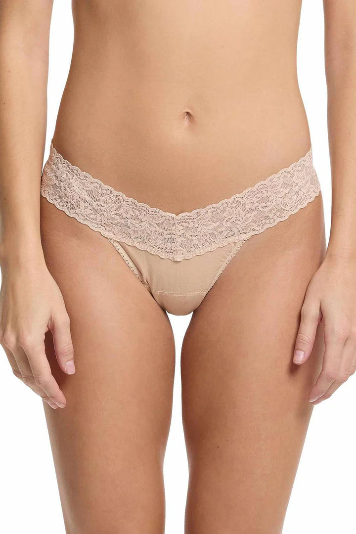 Beige lace cotton underwear on a white background