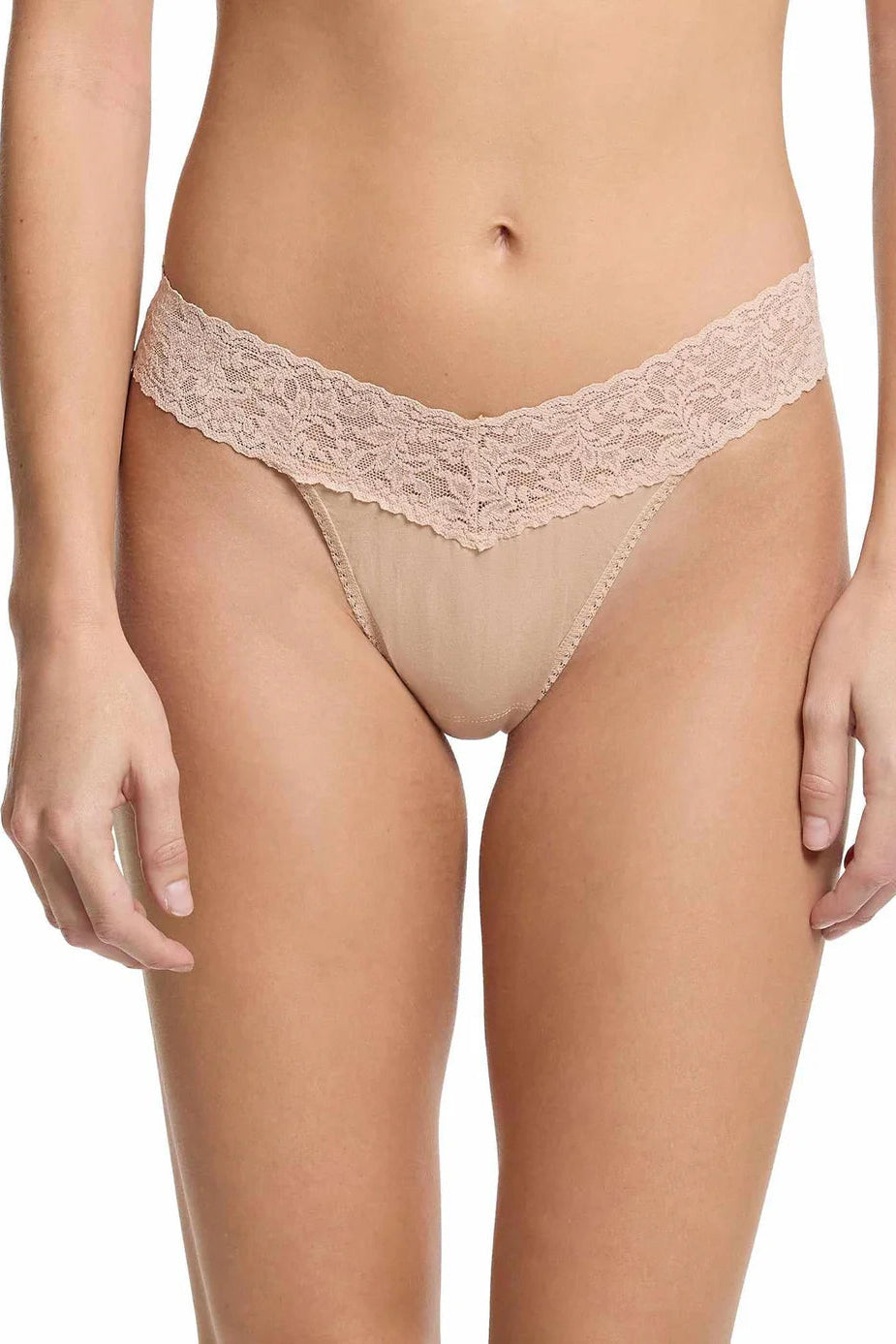 Lace thong worn by a model on a white background