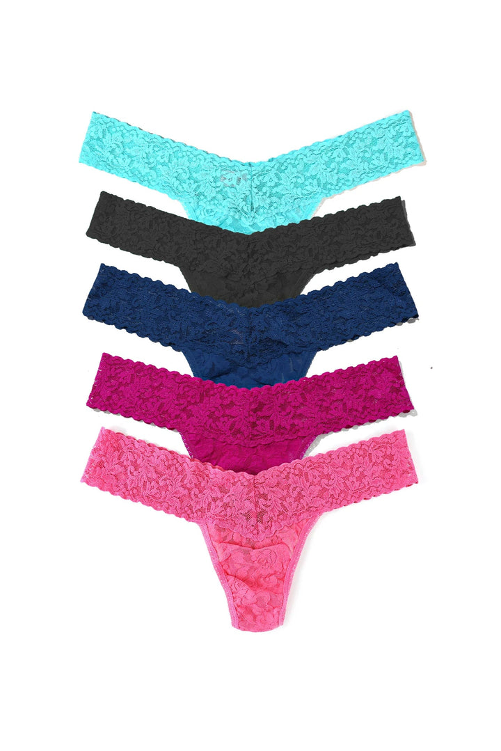 Set of five colorful lace thongs on a white background