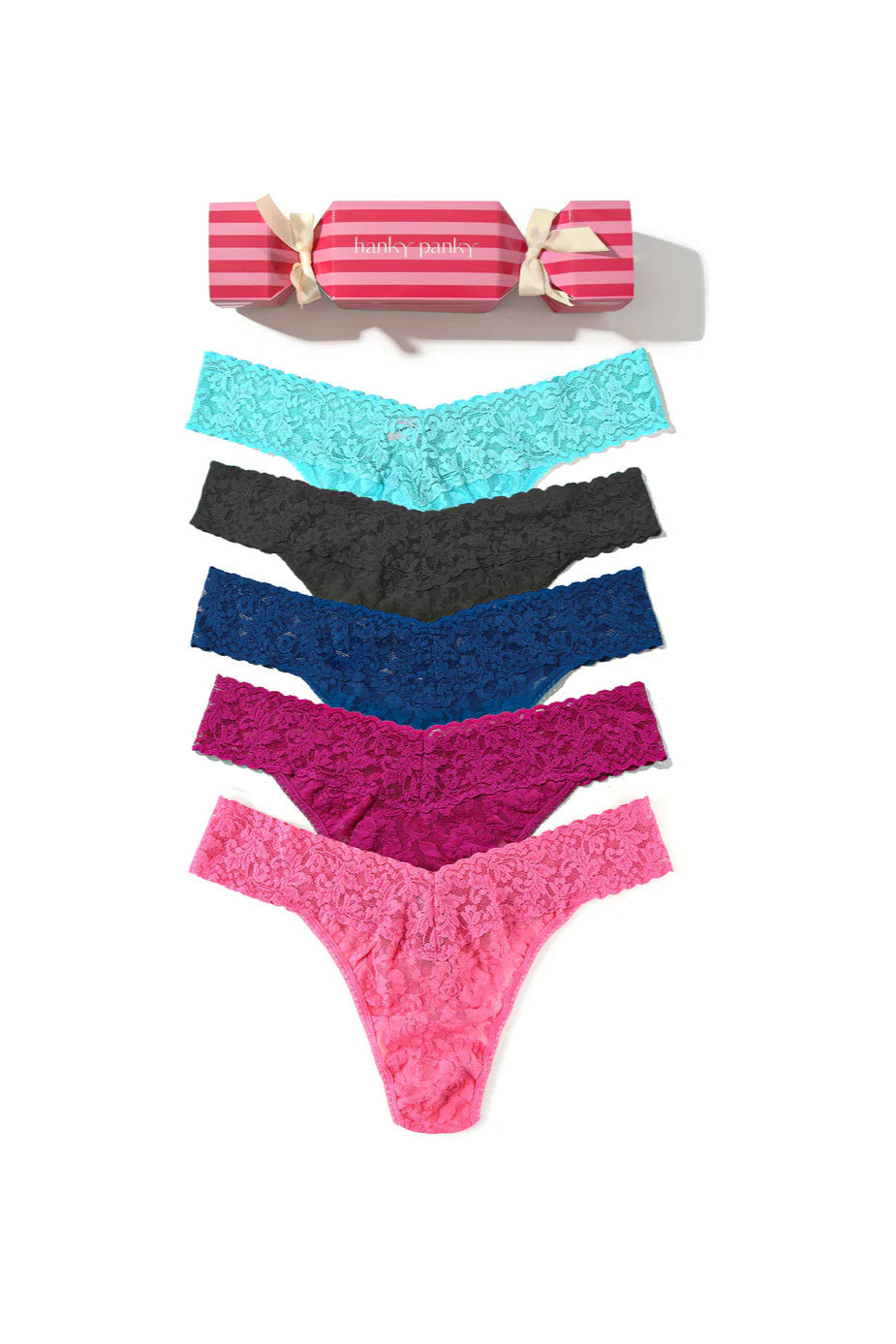 Set of colorful lace panties with a striped box on a white background