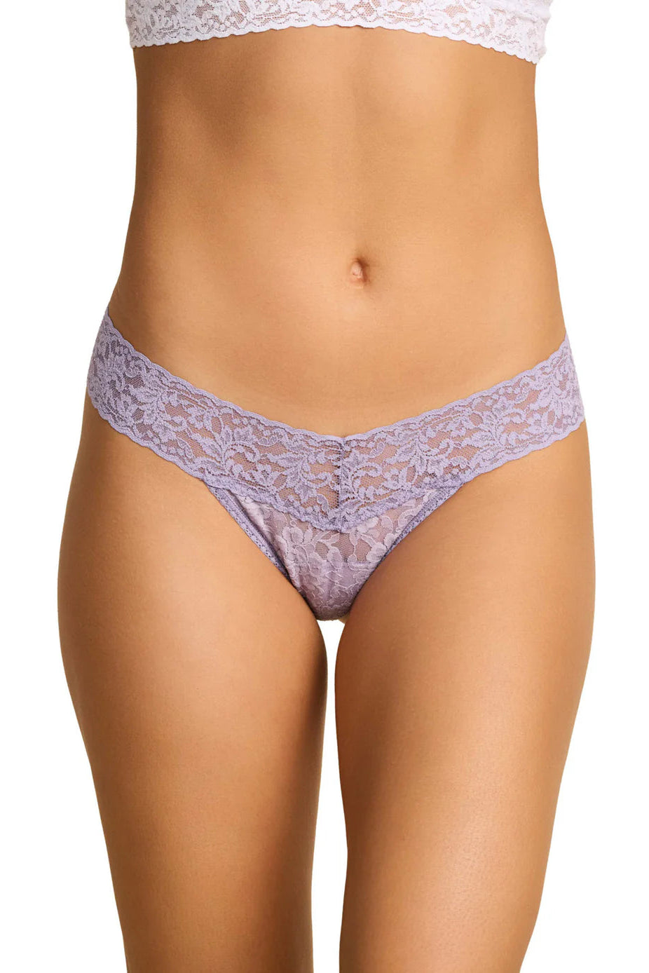 Lace underwear worn by a model on a white background