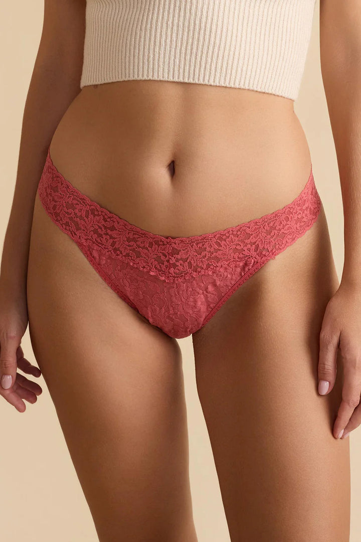 Woman wearing Hanky Panky original rise lace thong in color naples