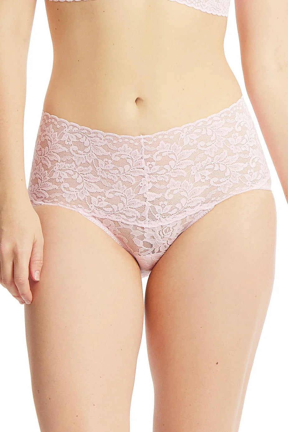 Lace underwear worn by a person on a white background