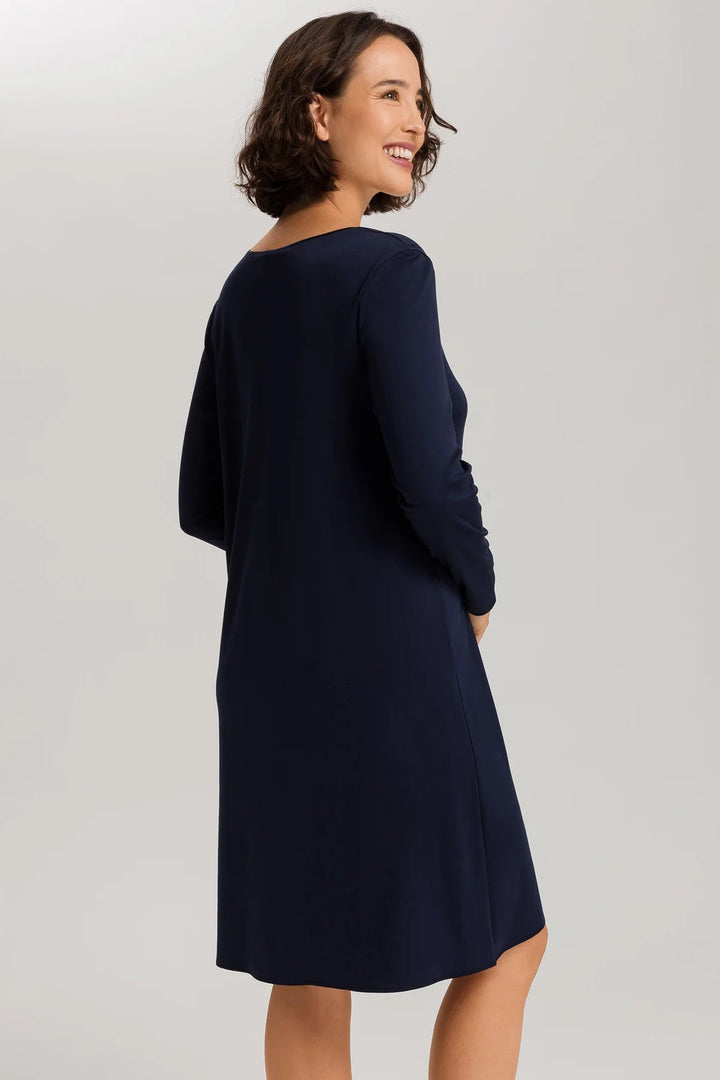 woman wearing a navy v-neck long sleeve A-line knee length night dress