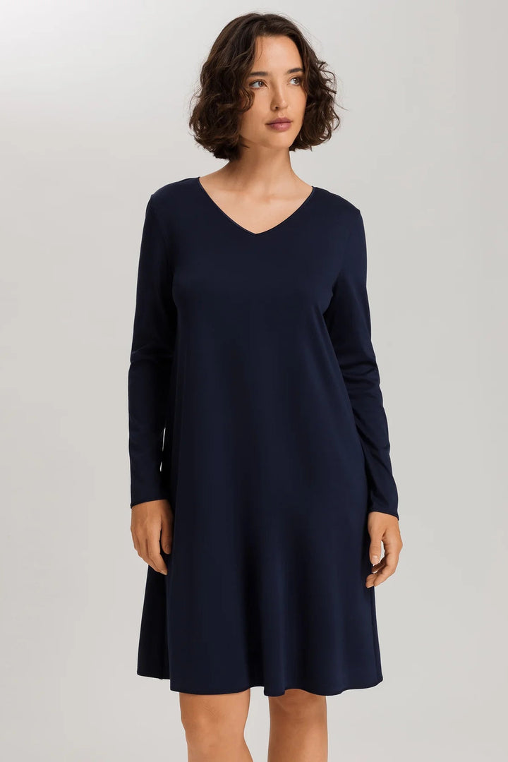woman wearing a navy v-neck long sleeve A-line night dress