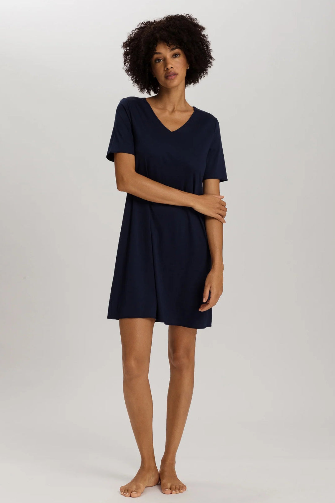 woman wearing a navy v-neck short sleeve A-line night dress