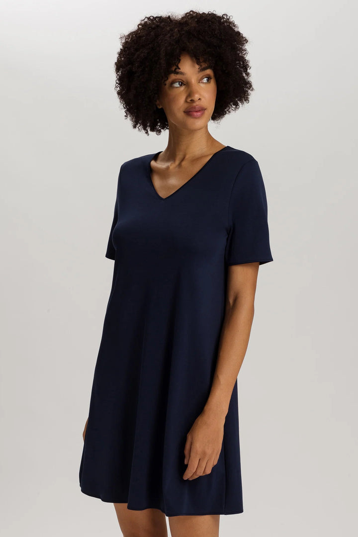 woman wearing a navy v-neck short sleeve A-line night dress