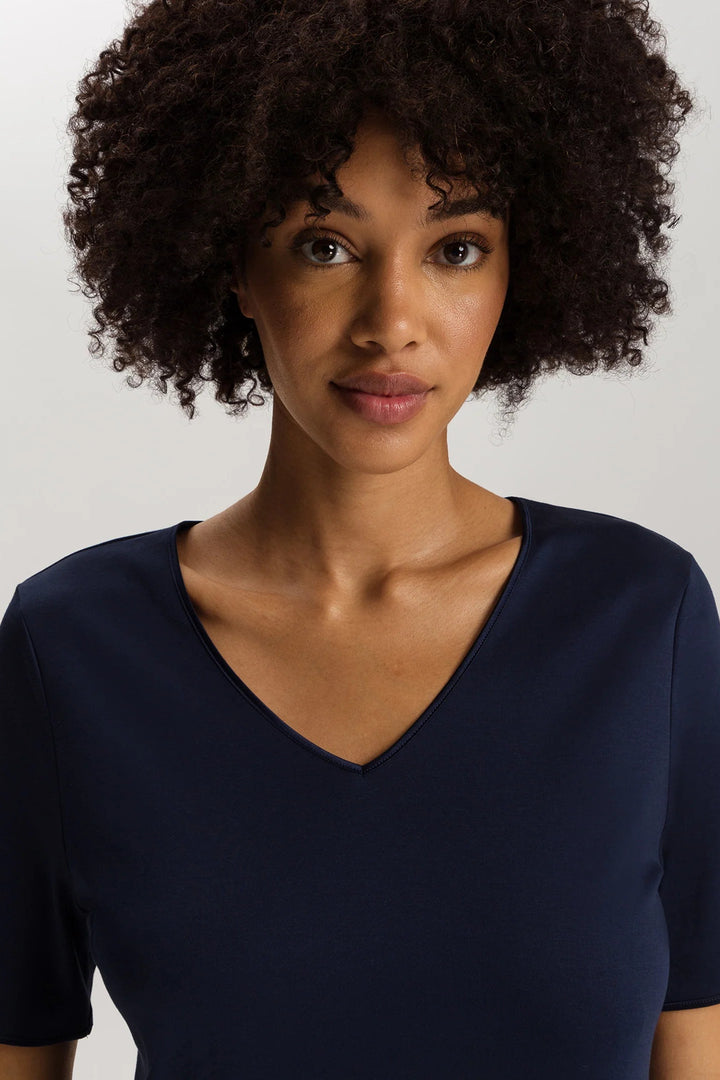 woman wearing a navy v-neck short sleeve A-line night dress