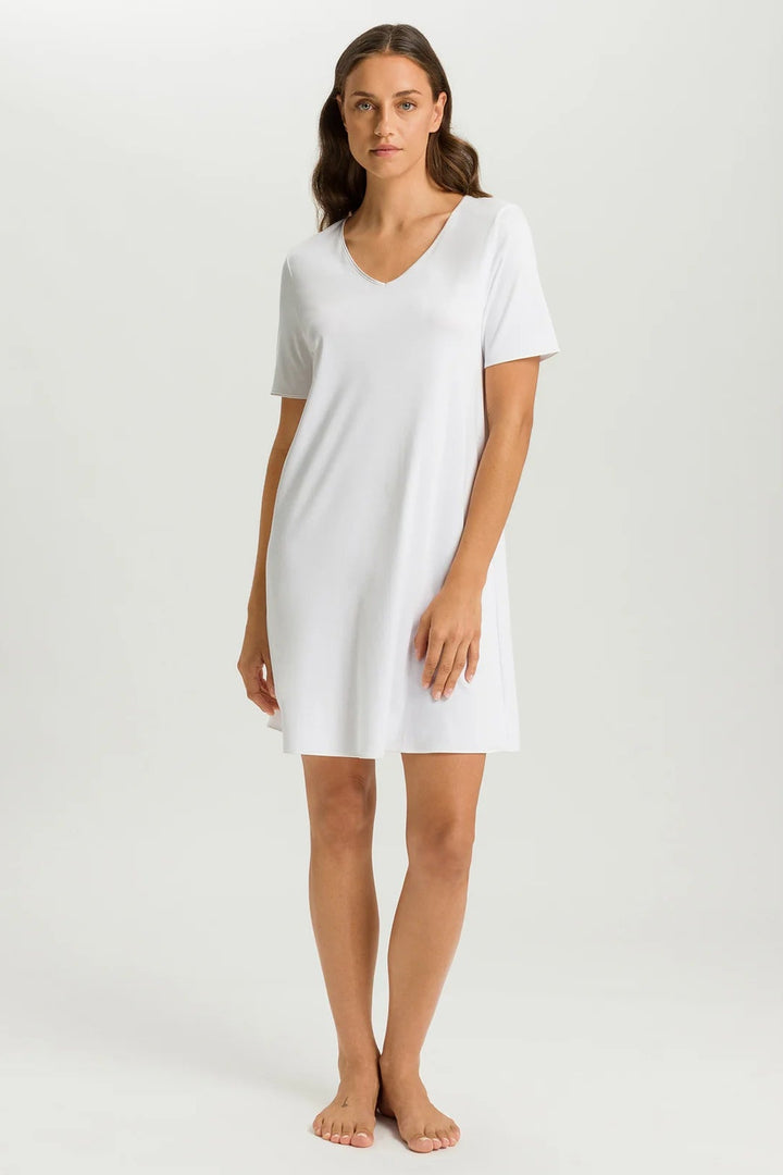 woman wearing a white v-neck short sleeve A-line night dress