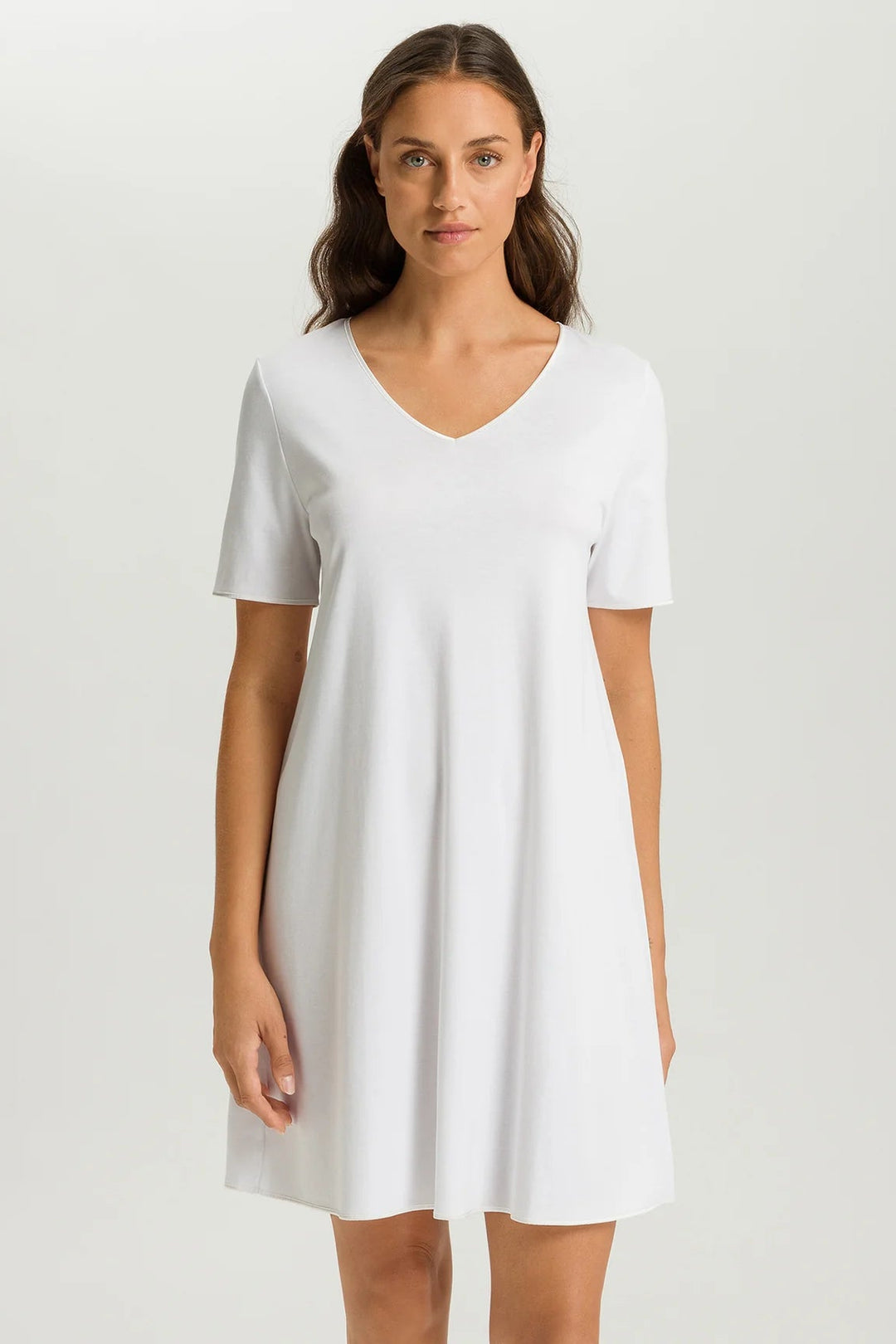 woman wearing a white v-neck short sleeve A-line night dress