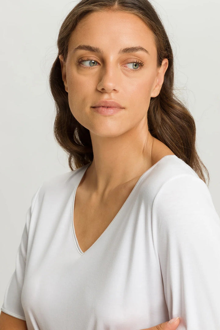 woman wearing a white v-neck short sleeve A-line night dress