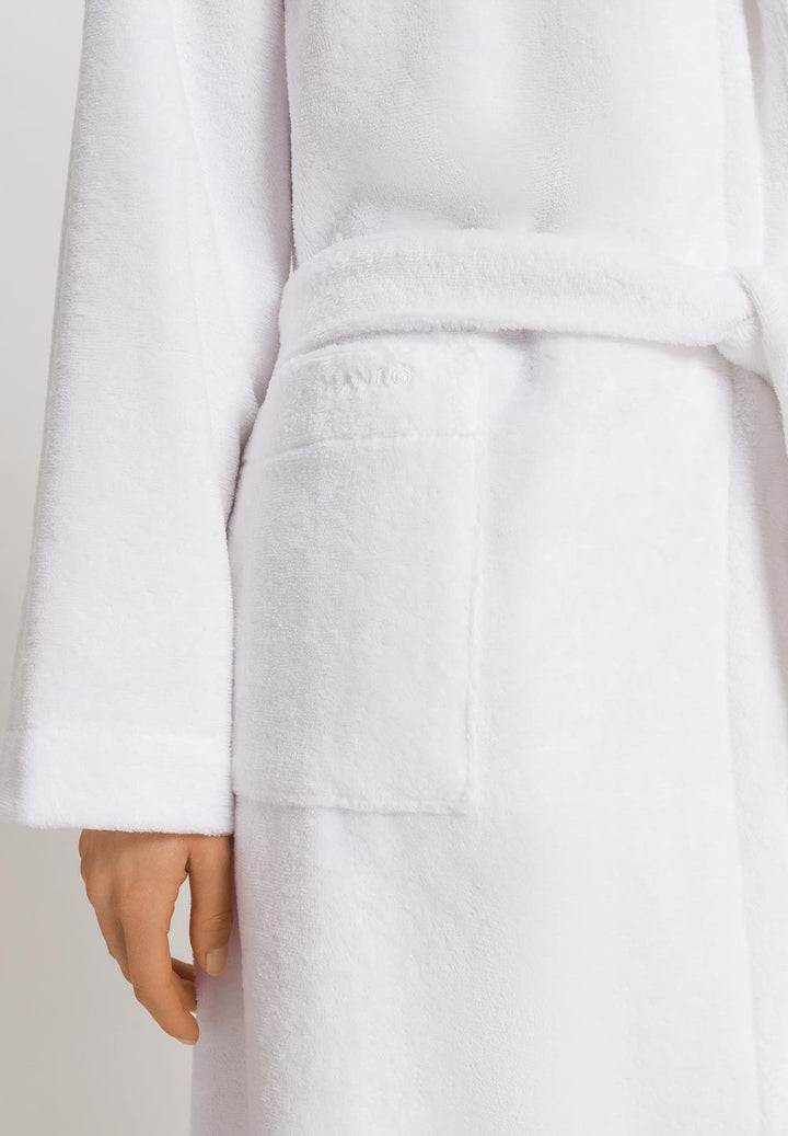 White bathrobe with a hand partially visible at the bottom