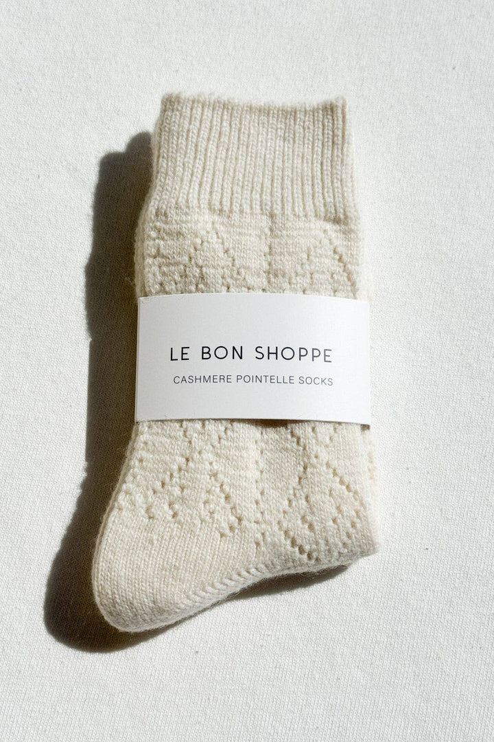 Pair of beige cashmere pointelle socks with 'Le Bon Shoppe' label on a light background