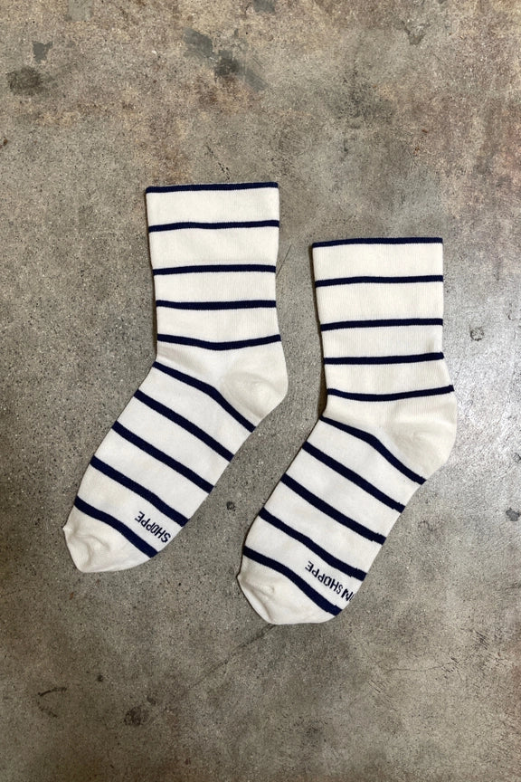 Pair of striped socks on a concrete surface