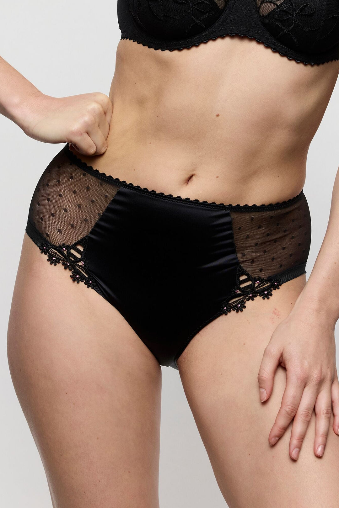 woman wearing the matching Noova full brief in black. sexy mesh lace with floral detail on the side. Retro style, featuring sexy boudoir look.