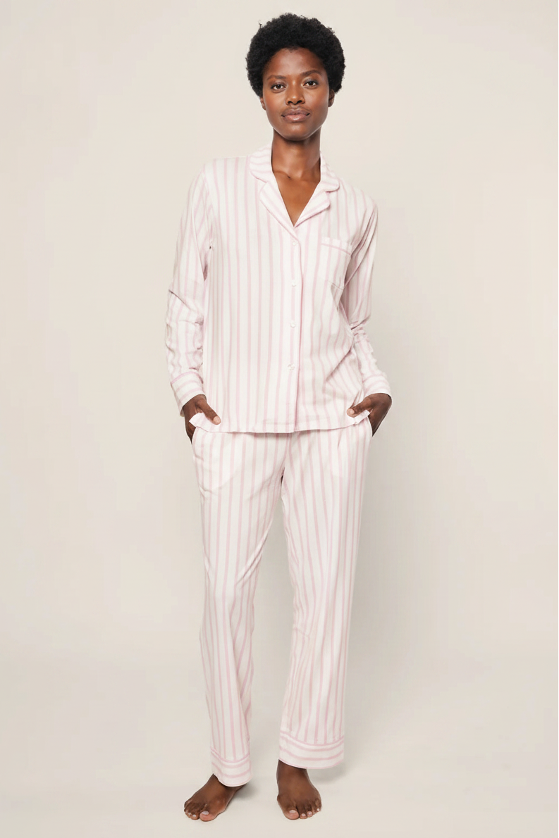 woman wearing the Petite Plume pima cotton pajama set in pink stripe. 