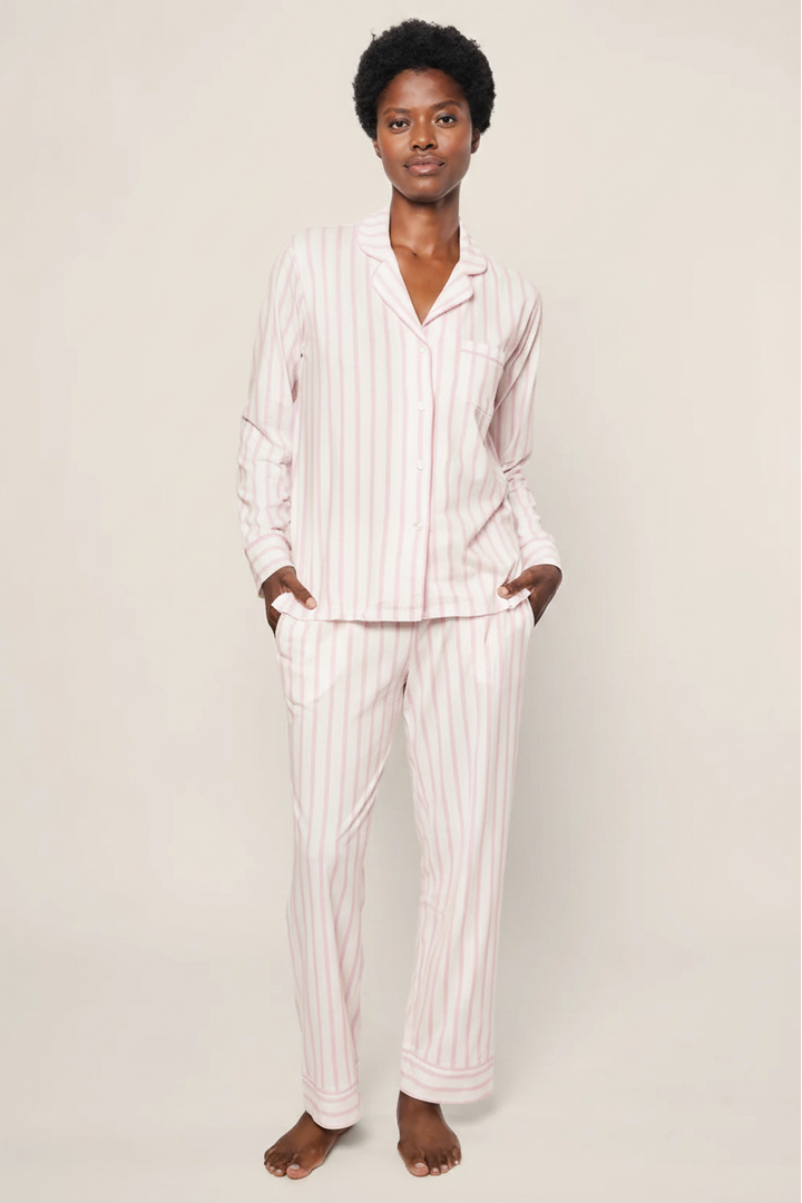 woman wearing the Petite Plume pima cotton pajama set in pink stripe. 
