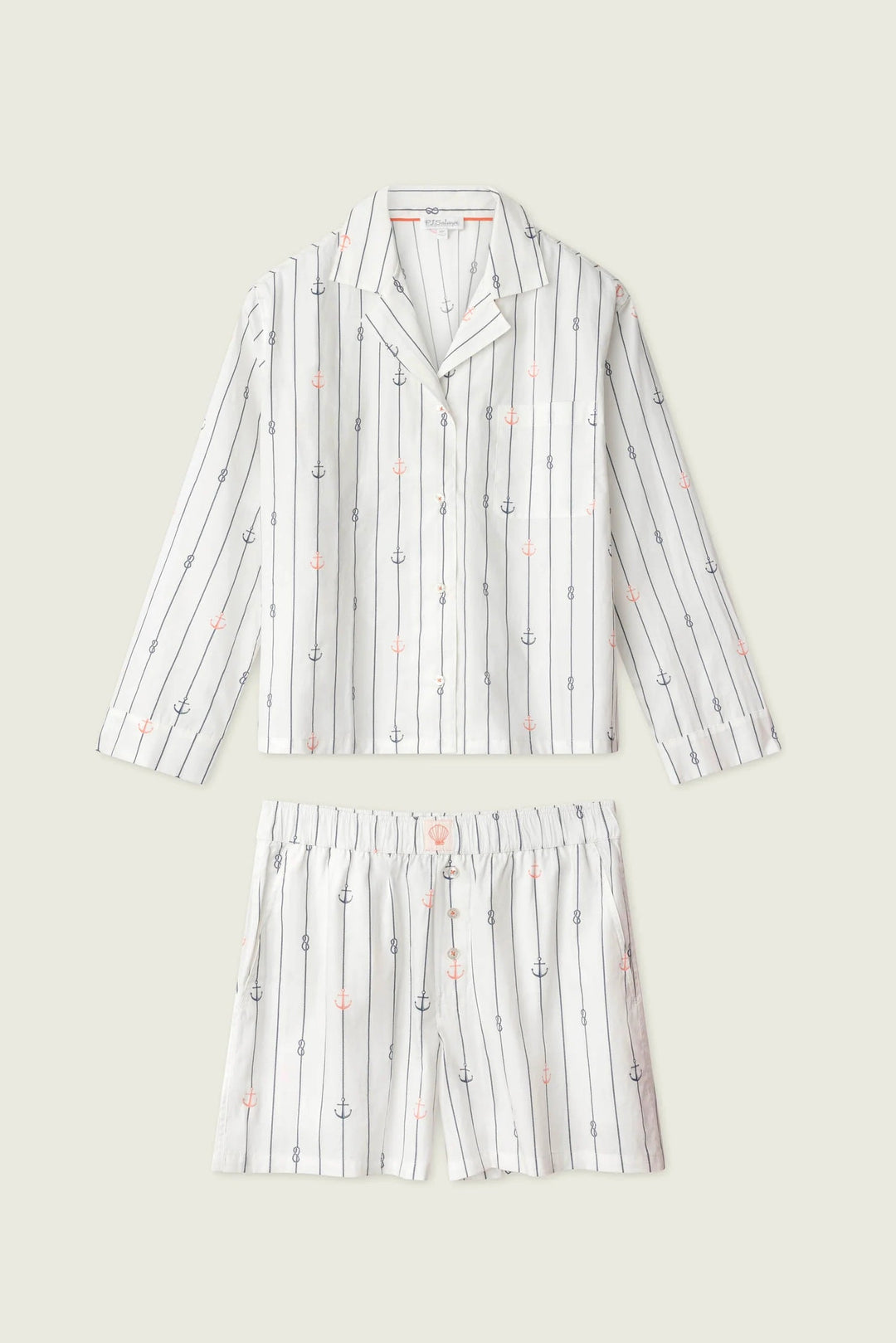 Striped pajama set with long-sleeve top and shorts on a light gray background