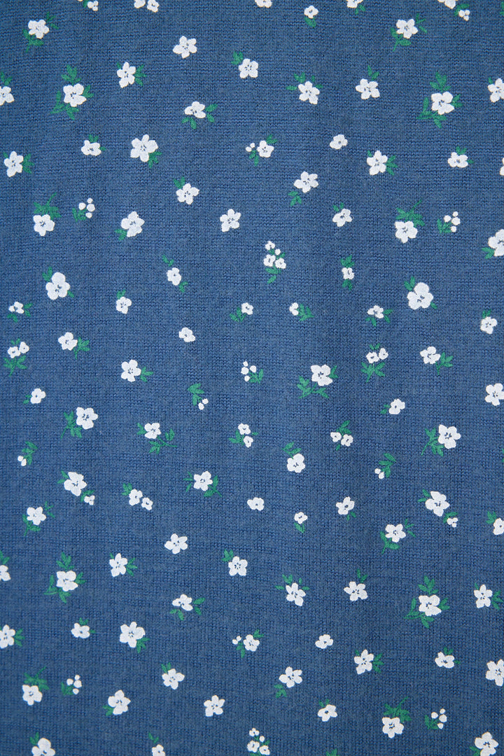 Blue fabric with small white floral pattern