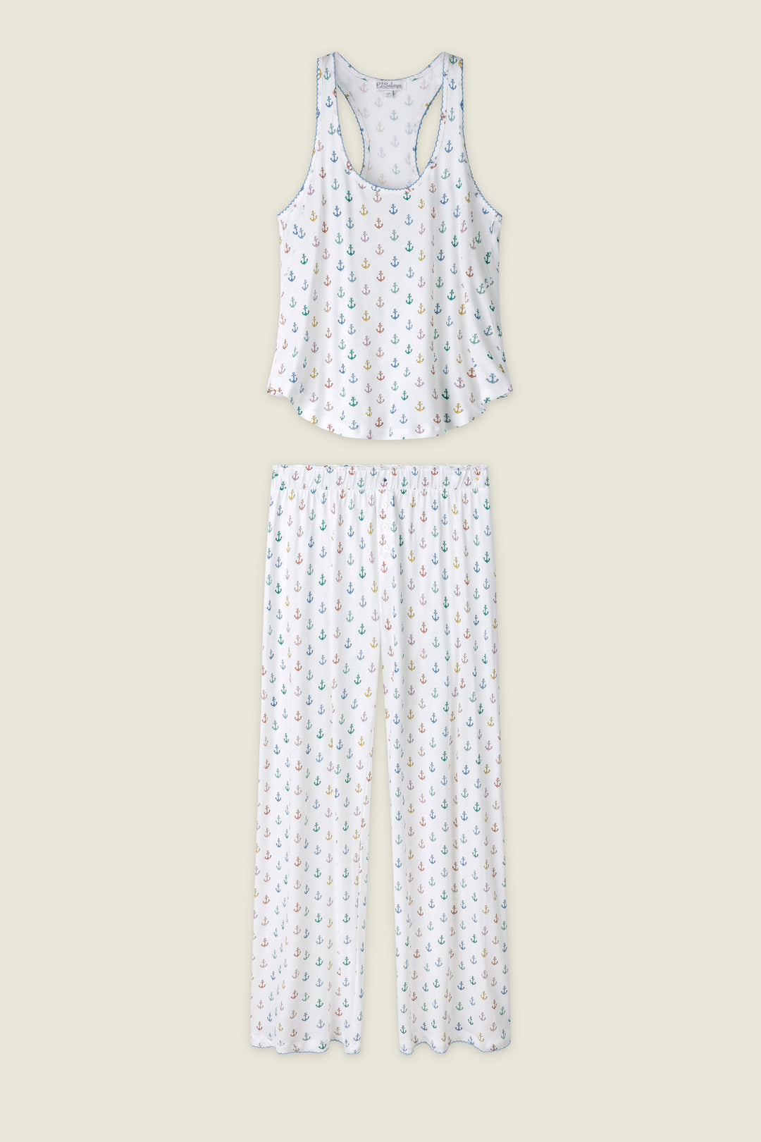Set of pajama top and pants with a subtle pattern on a light beige background