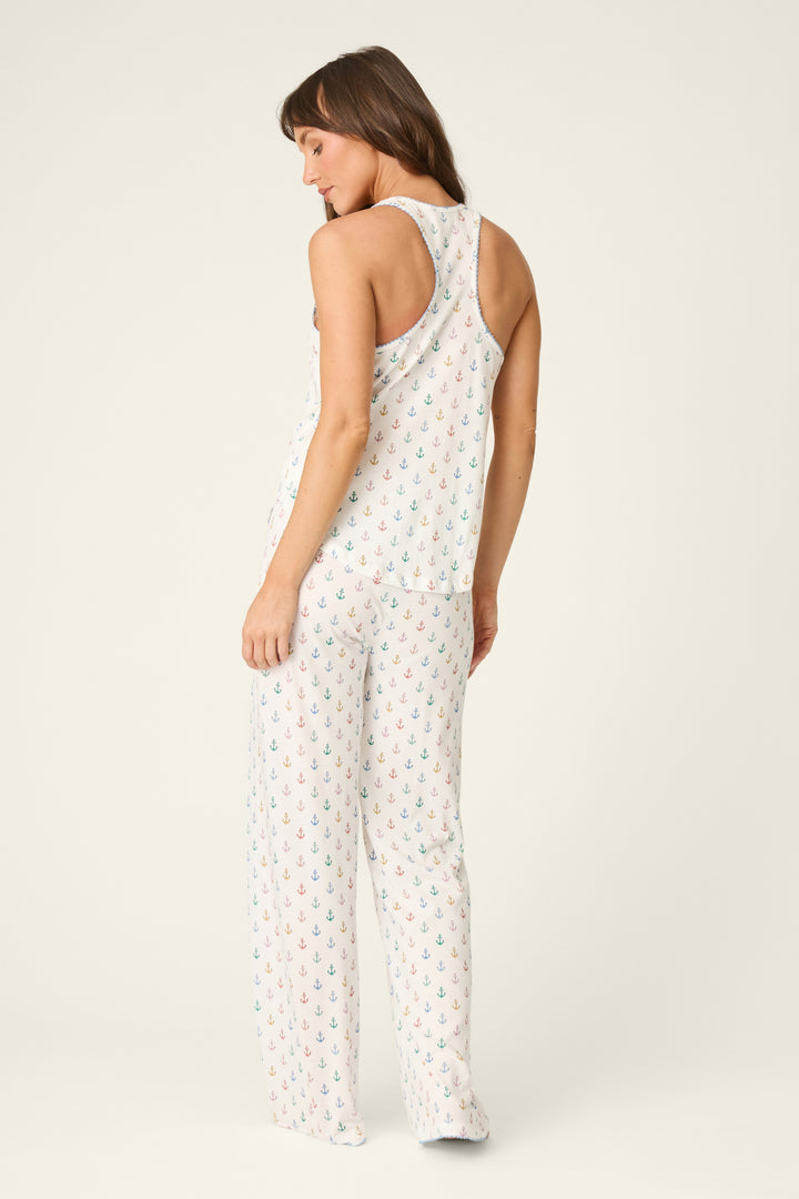 Woman wearing a white pajama on a plain background