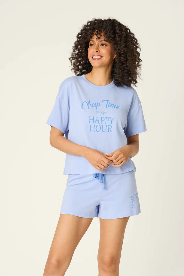 Woman wearing a light blue pajama set with text on a white background