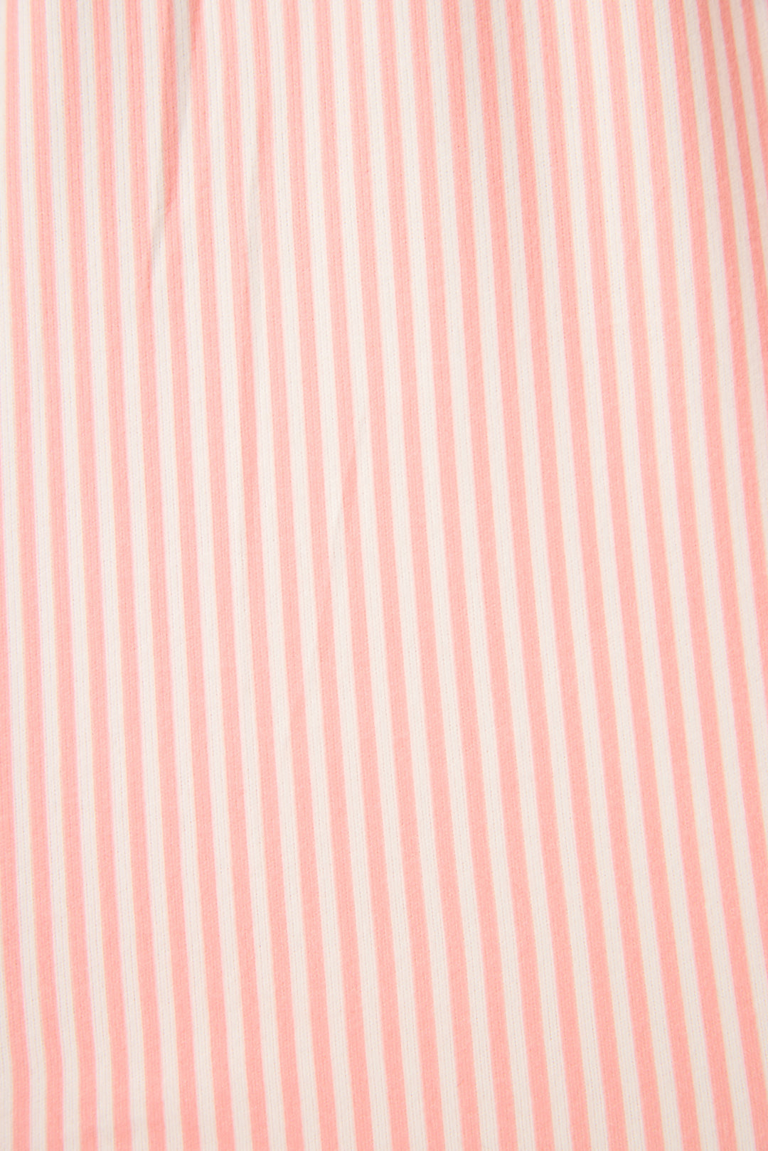 Close-up of pink fabric with subtle stripes