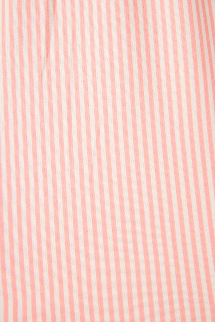 Close-up of pink fabric with subtle stripes