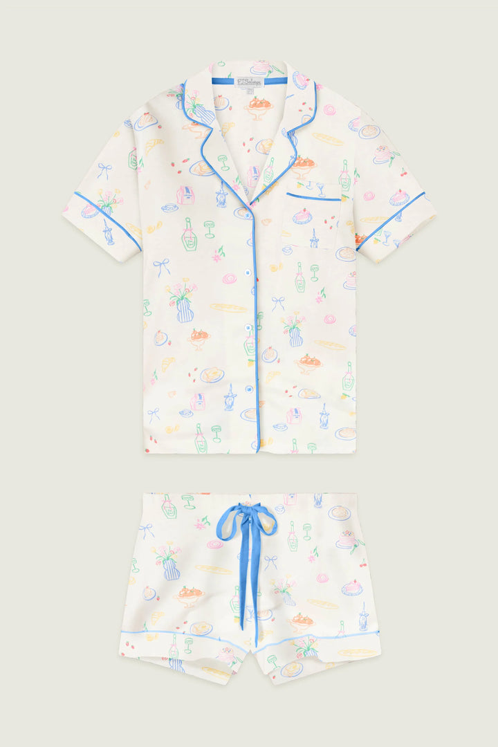 colorful pajama set with food designs on a plain background
