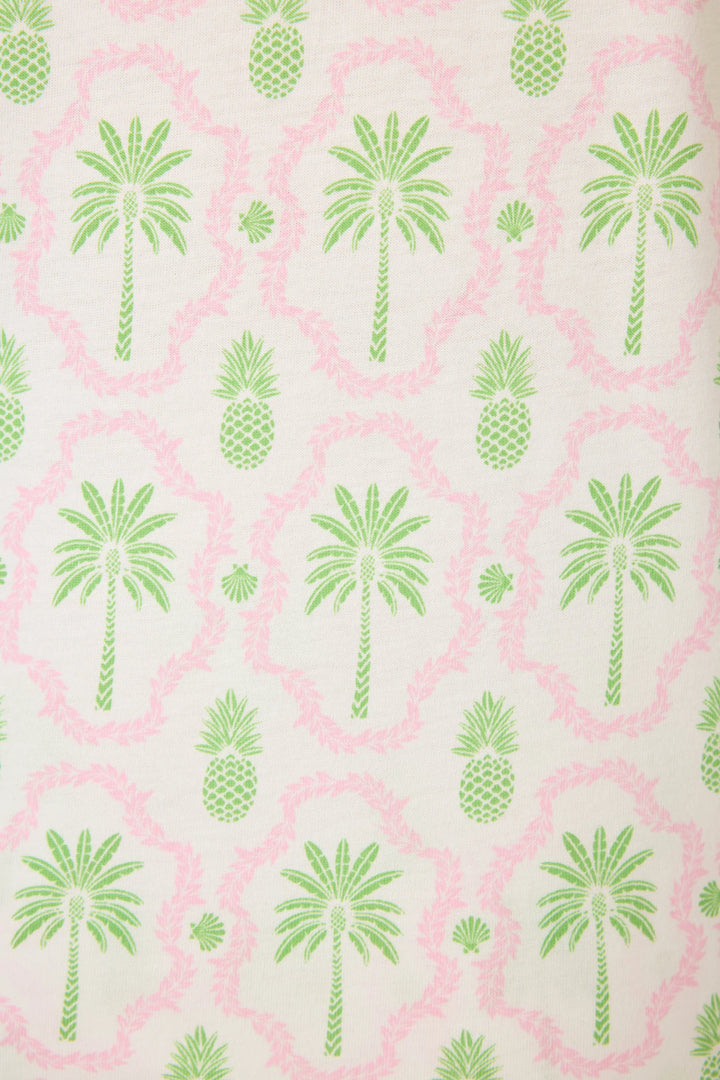 Pattern of green palm trees and pineapples on a light pink background