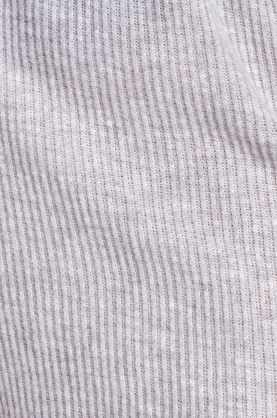Close-up of a ribbed knit fabric with vertical stripes in light gray and white.