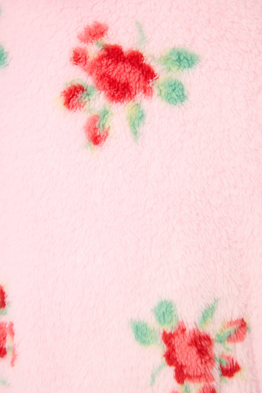 Floral pattern on a pink fabric background