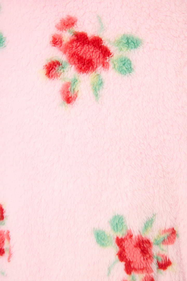 Floral pattern on a pink fabric background