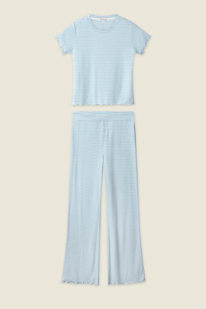 Light blue striped t-shirt and pants set on a beige background